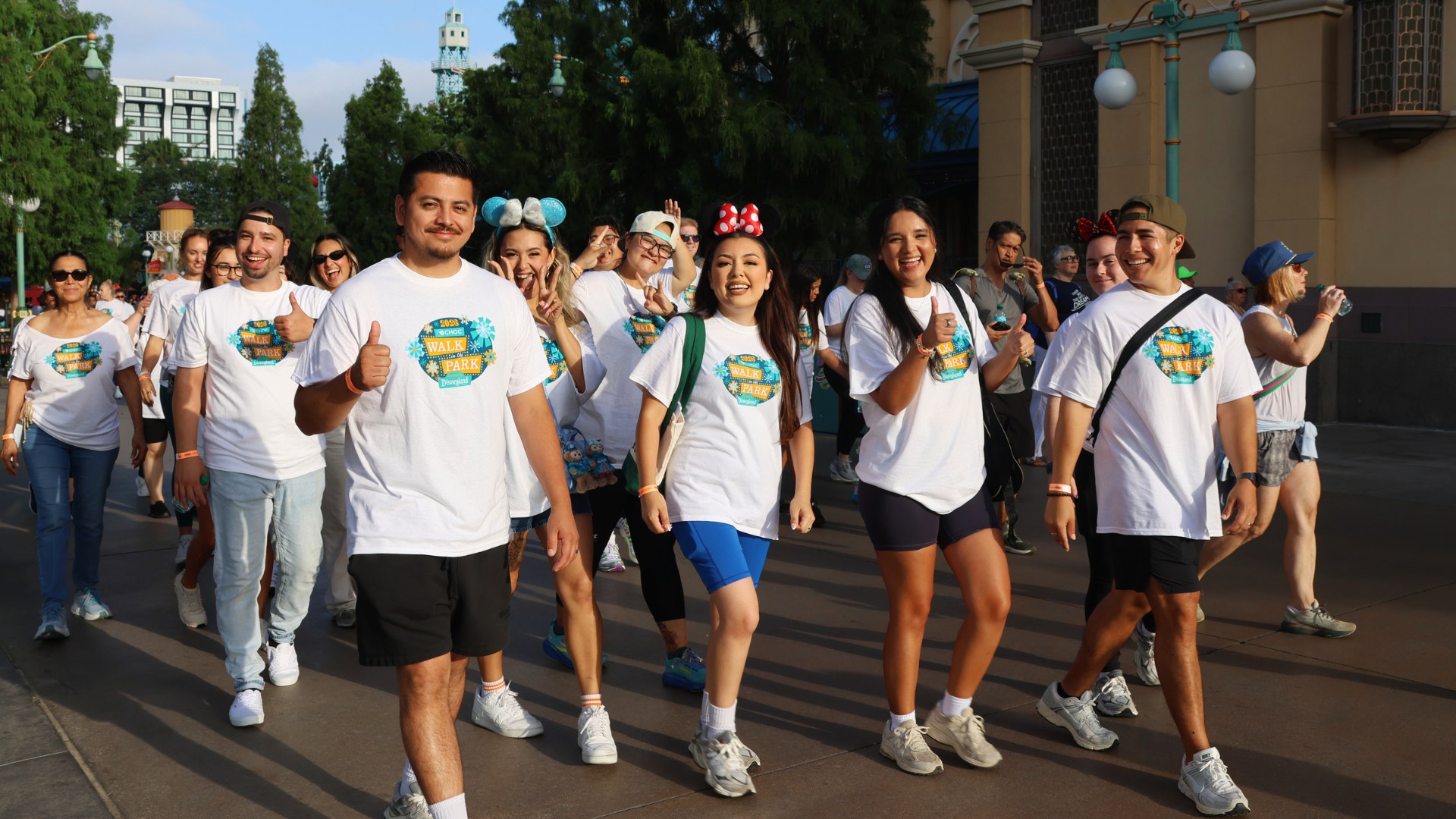 Walkers in CHOC Walk in the Park shirts walking the route through Disney California Adventure