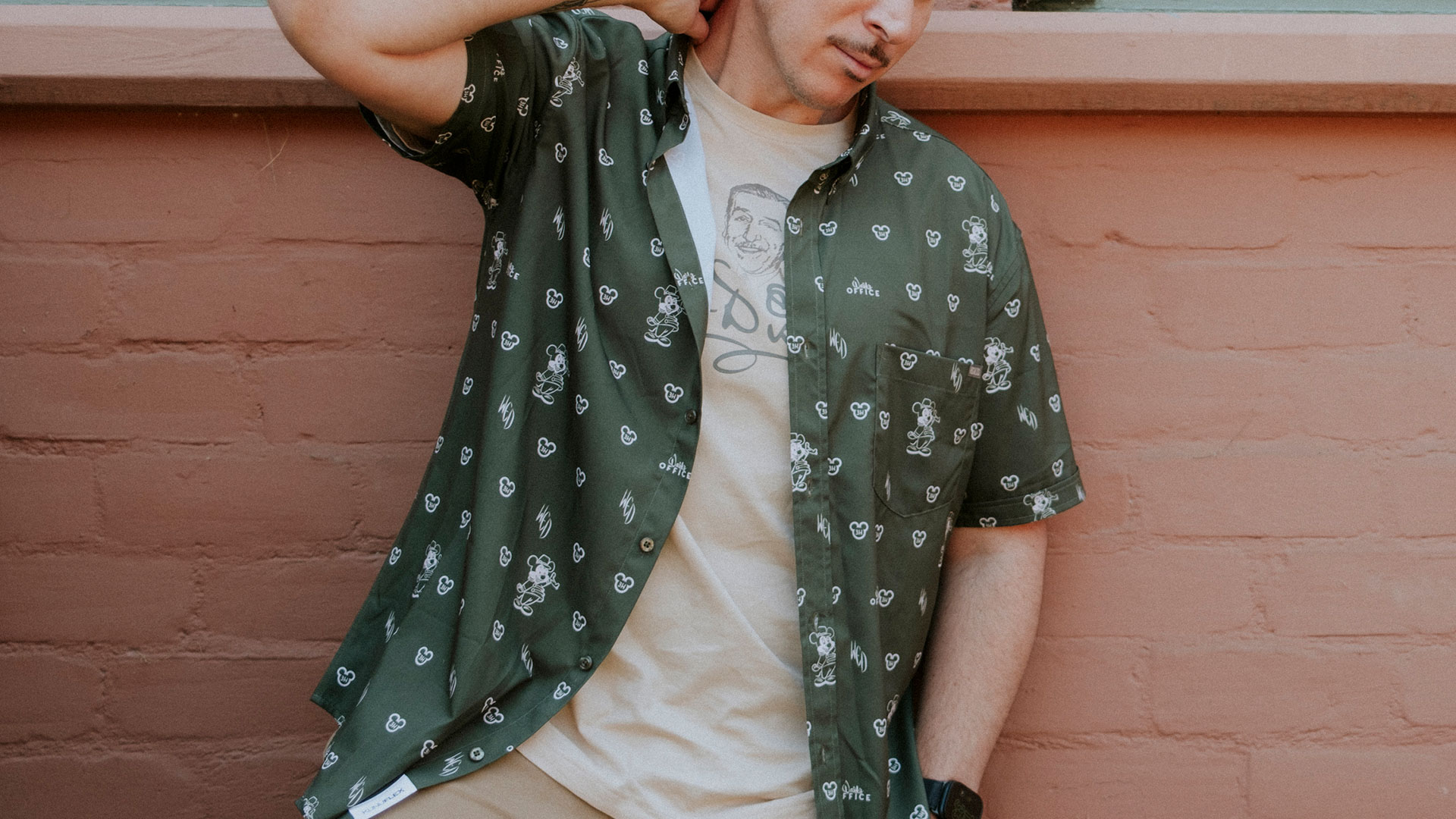 Green Mickey Mouse patterned button-up shirt from the Walt's Office merchandise collection