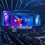 The Disney Entertainment Showcase stage at Honda Center with Sorcerer Mickey on the screen for D23 2026