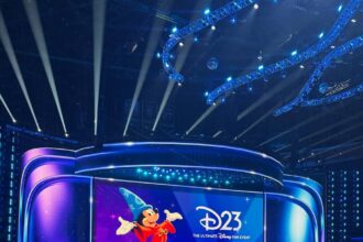 The Disney Entertainment Showcase stage at Honda Center with Sorcerer Mickey on the screen for D23 2026