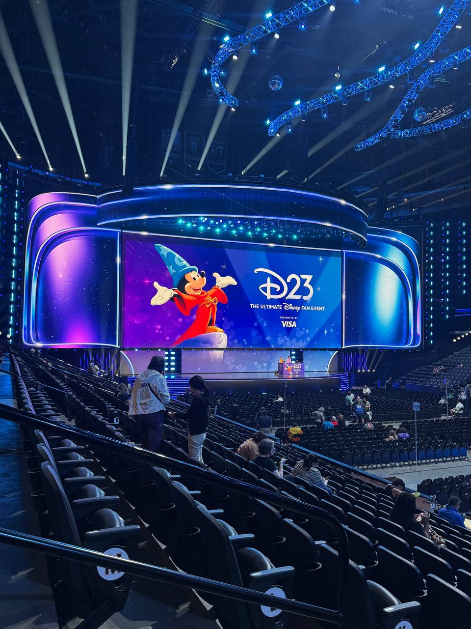 The Disney Entertainment Showcase stage at Honda Center with Sorcerer Mickey on the screen for D23 2026