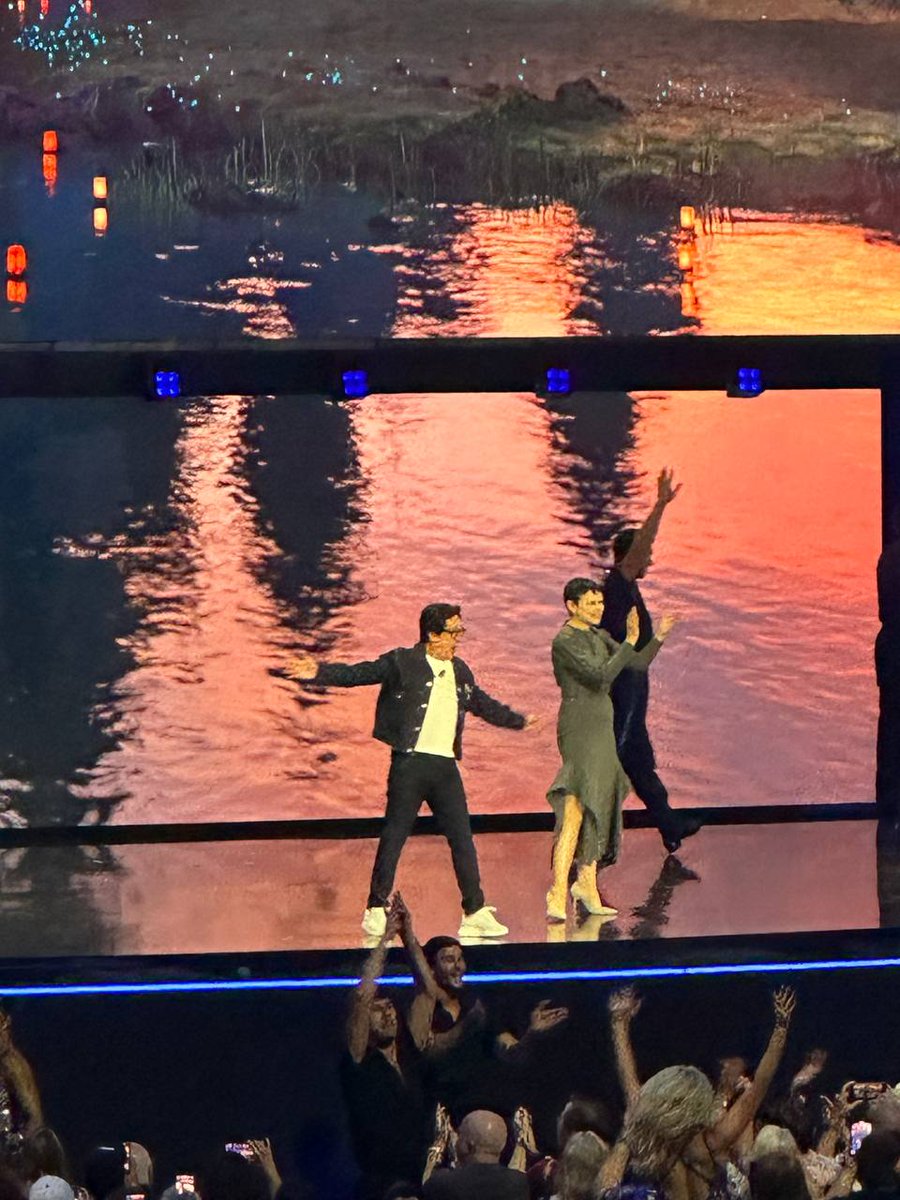 Ke Huy Quan and Ginnifer Goodwin are on stage hosting the Disney Entertainment Showcase at D23.