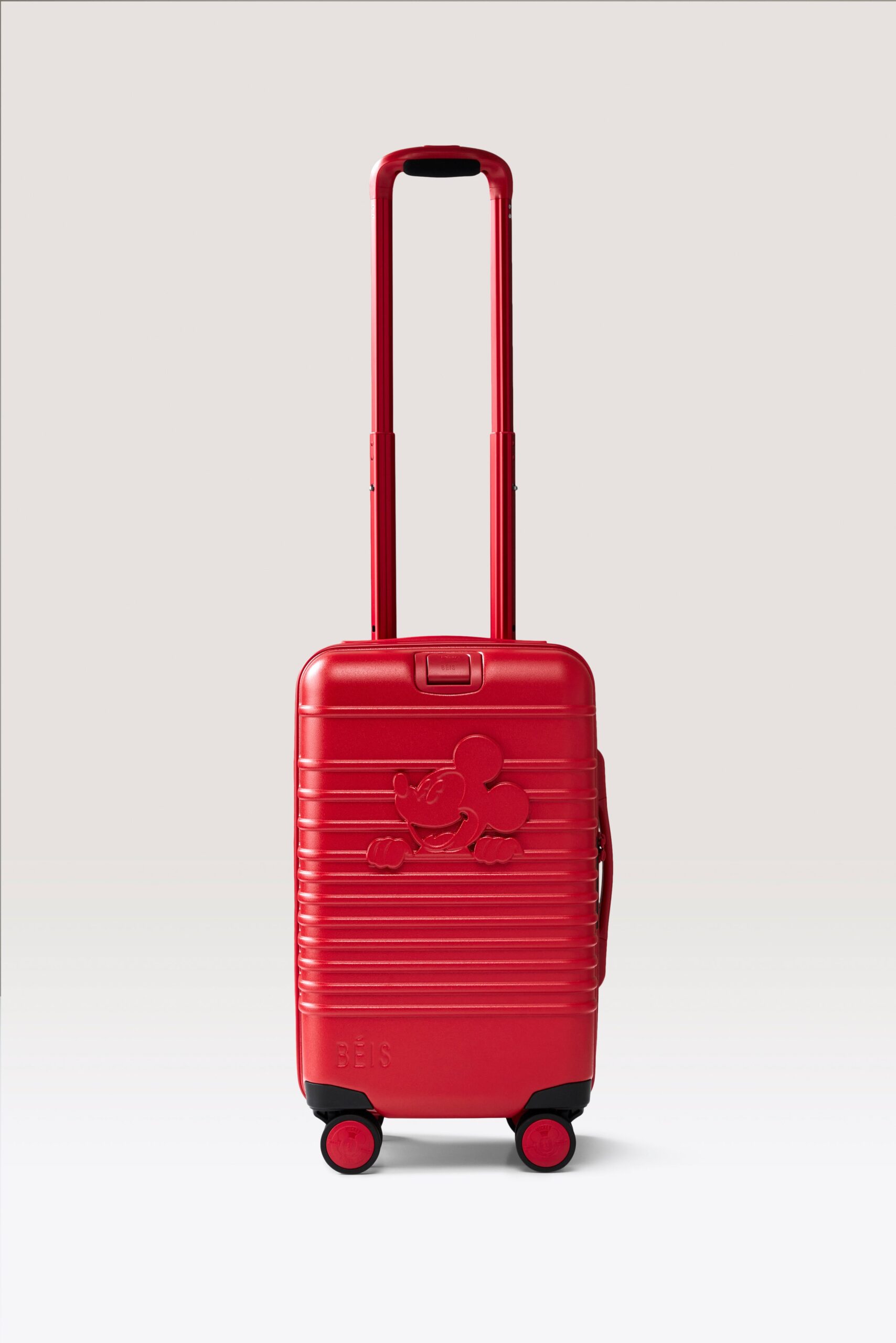 The Disney Small Carry-On Roller in Mickey Mouse Red from the Disney x BEIS collection