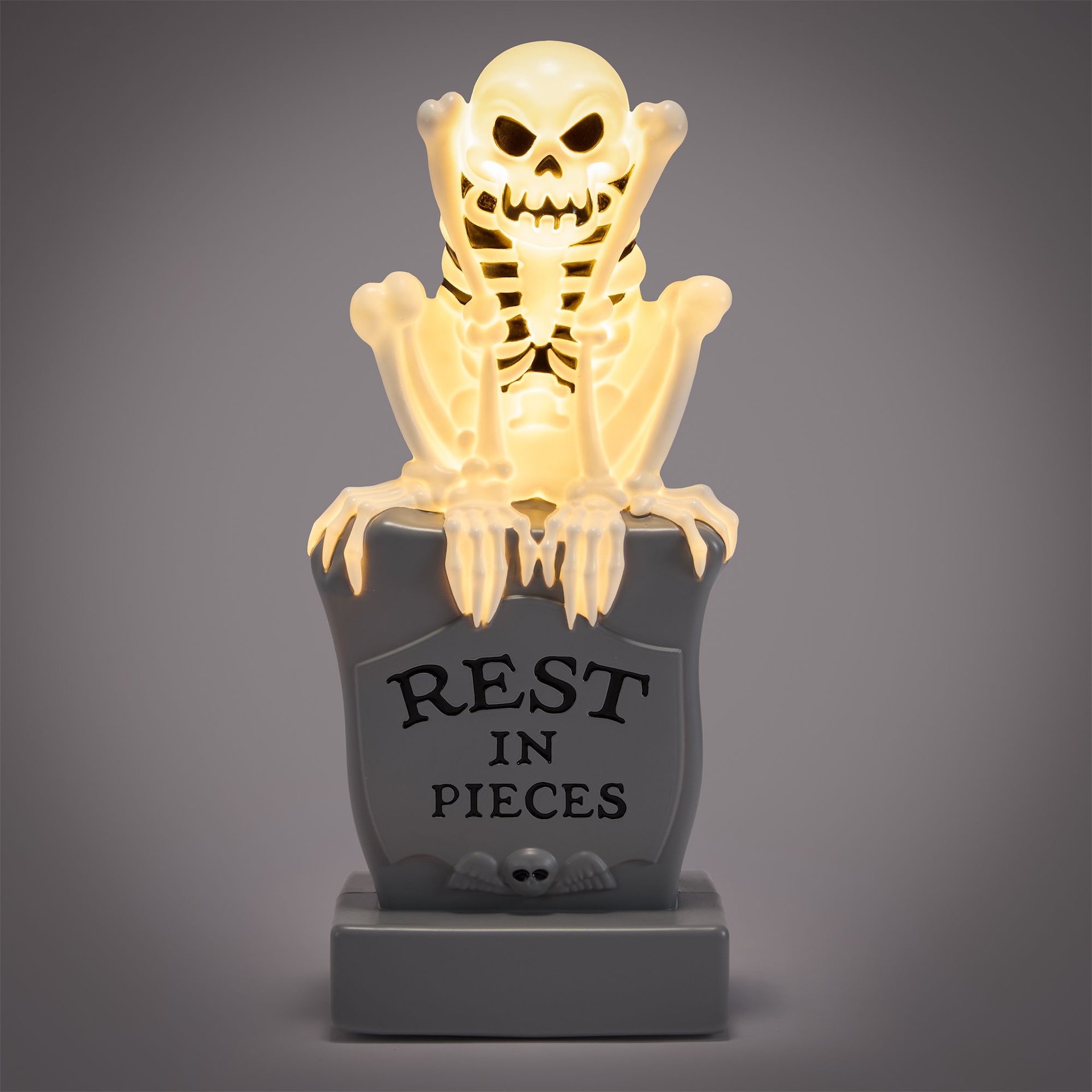 The Skeleton Dance Light-Up Figure on a tombstone