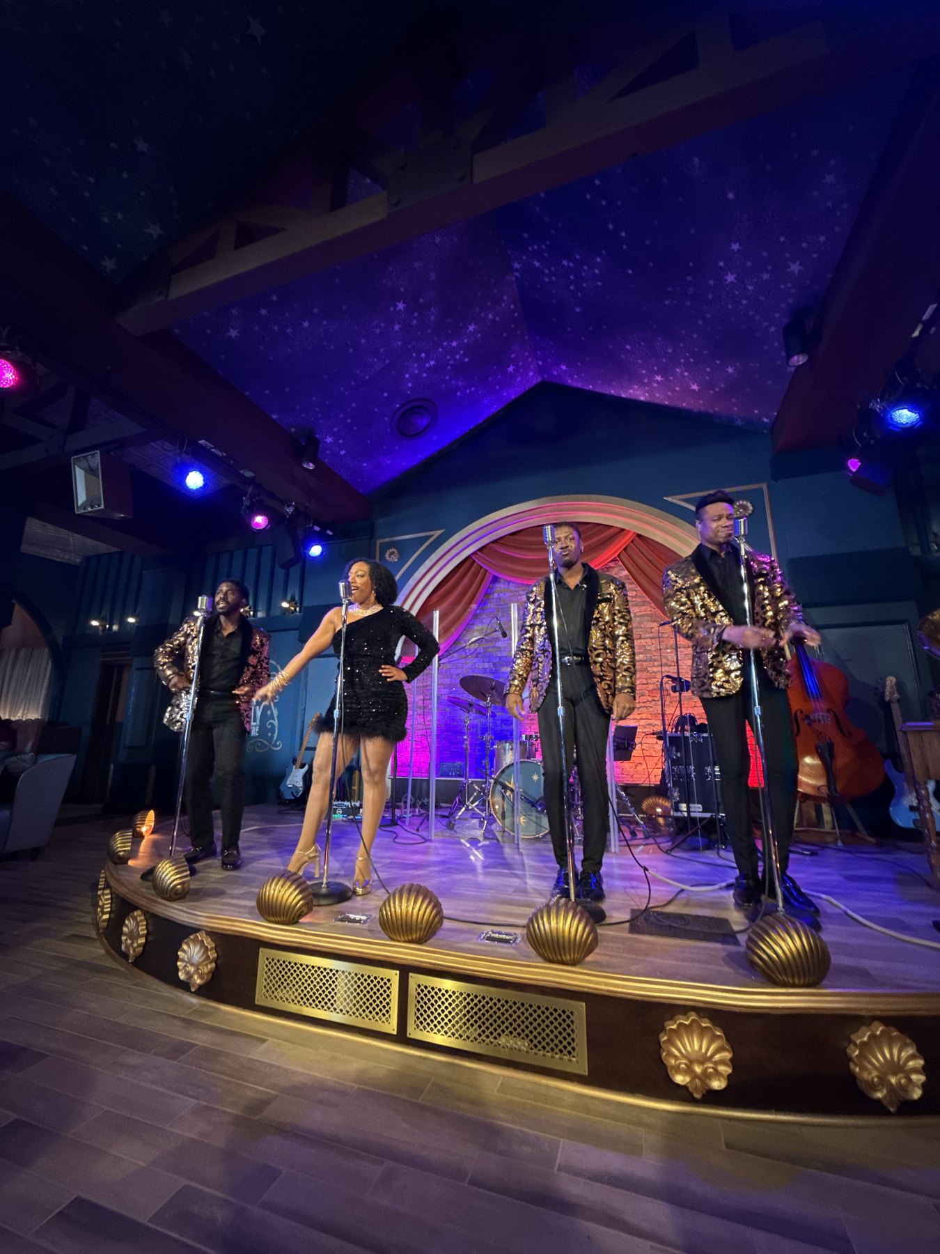 A vertical view of the Motown performers under the stage lights.