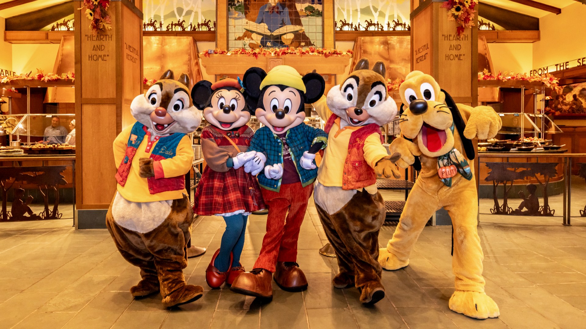 Disney characters in festive outfits.