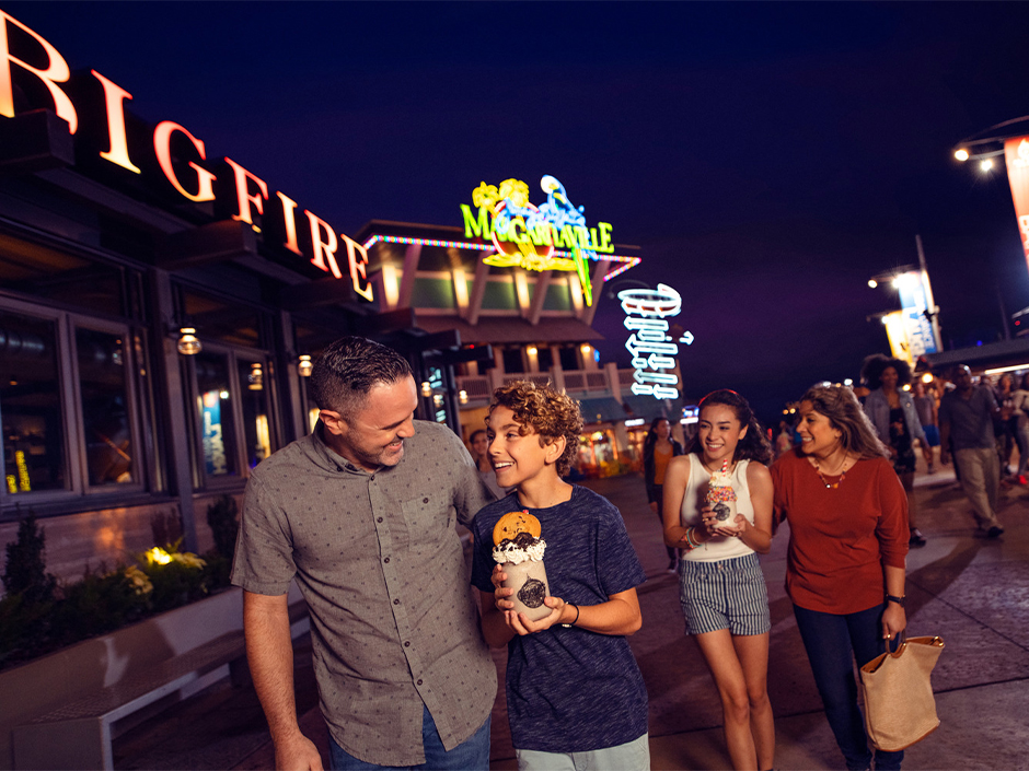 A family walking through Universal CityWalk at Universal Orlando Resort