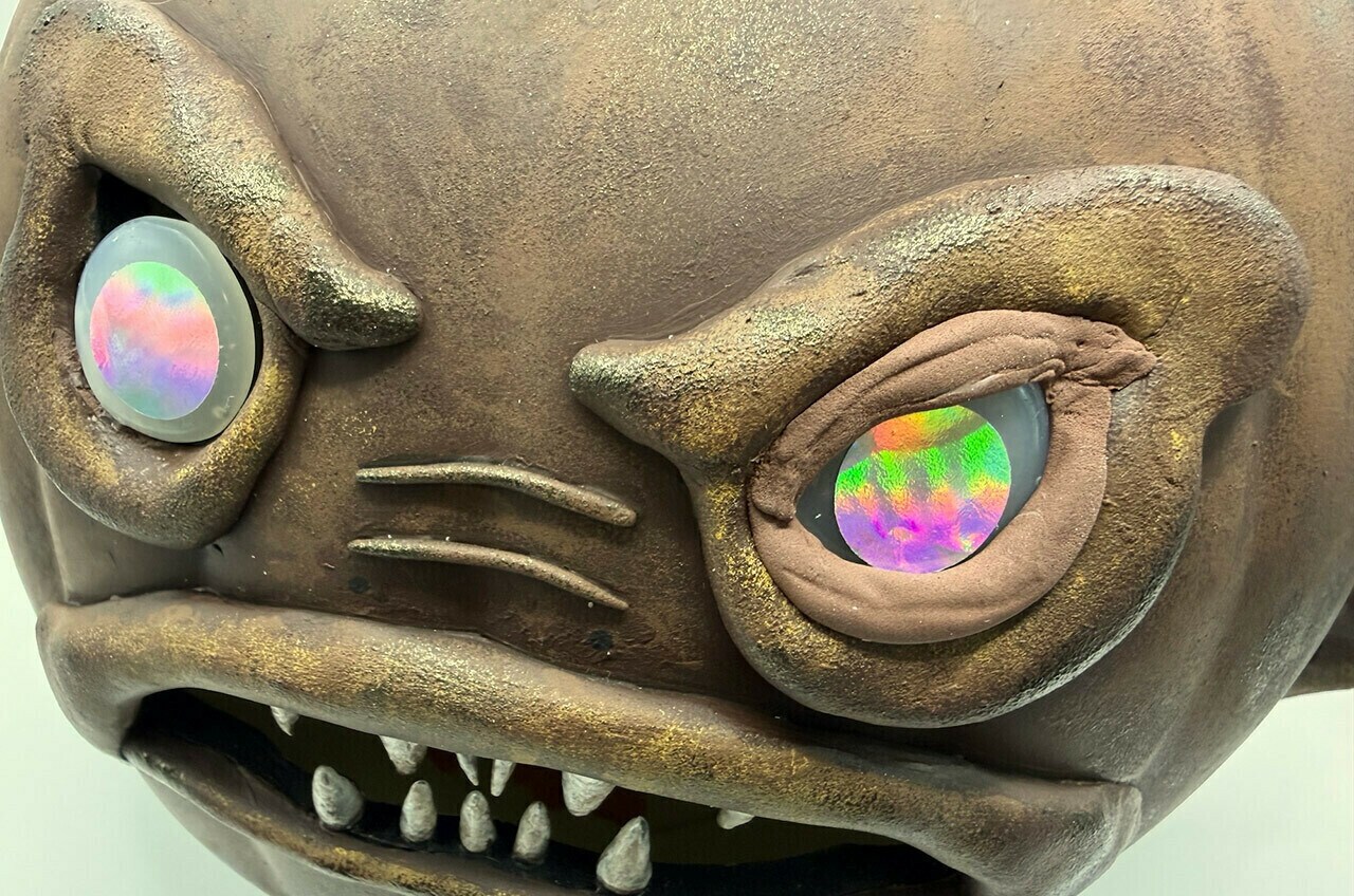Roll the modeling clay and press around the eyes to make the lids.