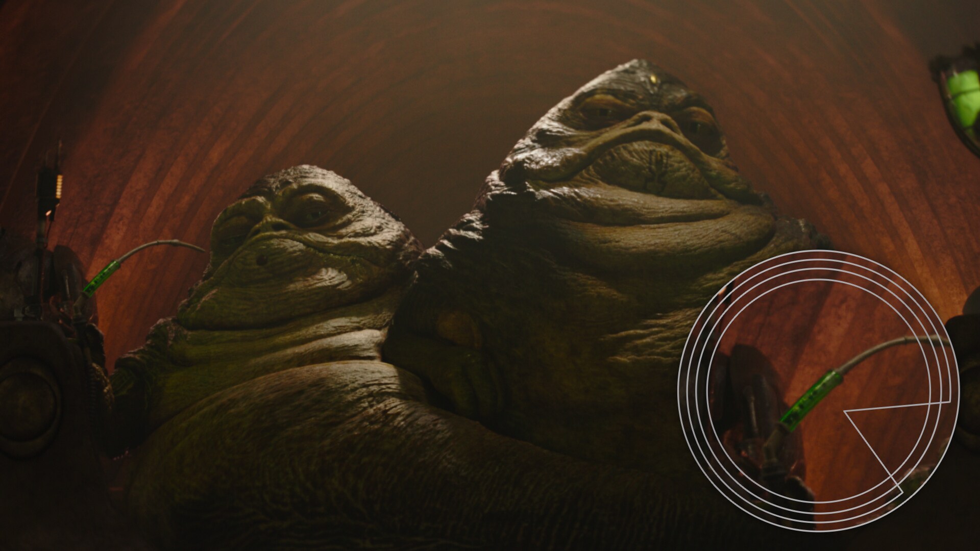The female Hutt twin is not smoking a hookah like her cousin Jabba the Hutt, it's a straw.